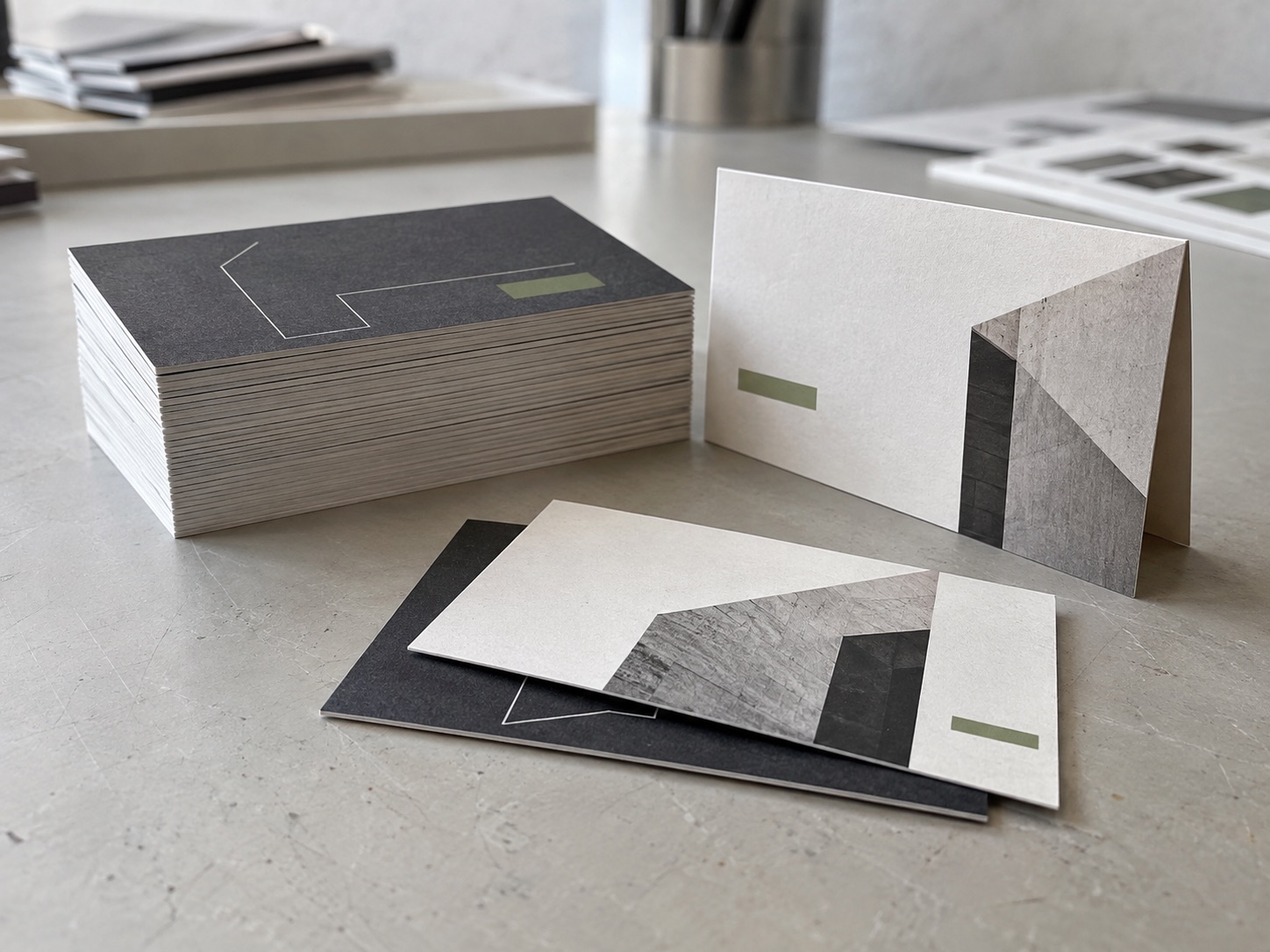 Printed standard and folded business cards with visible paper edges